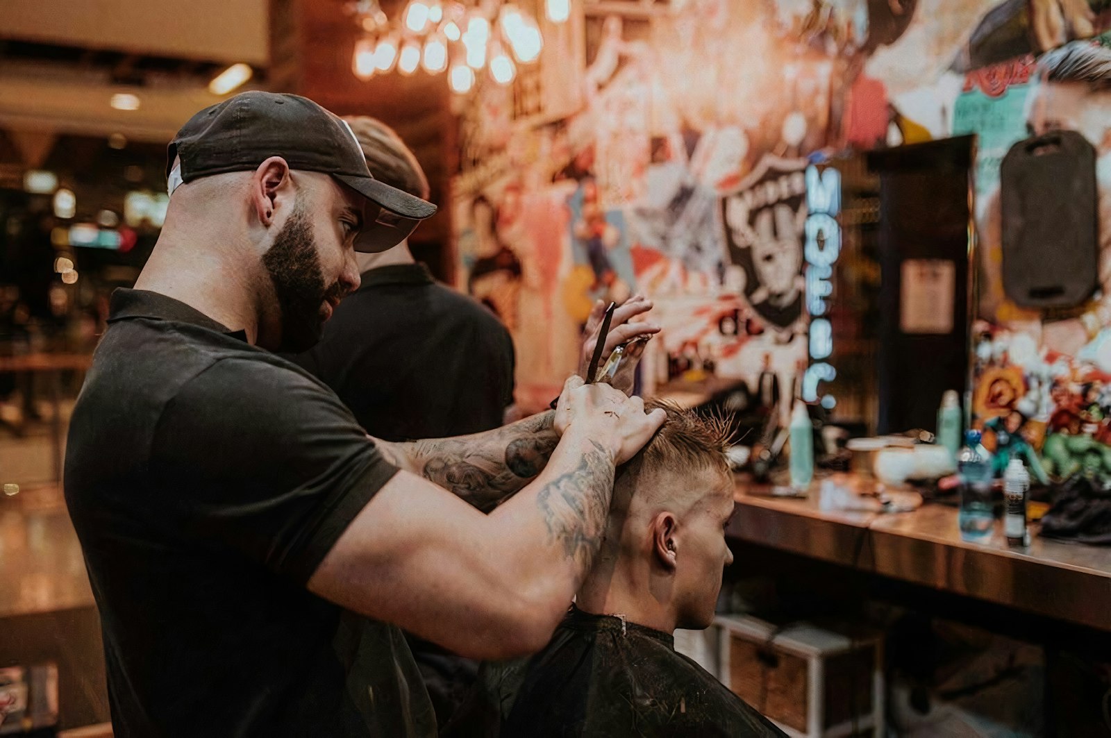 Barber giving a client a fresh fade at FADEHOUSE
