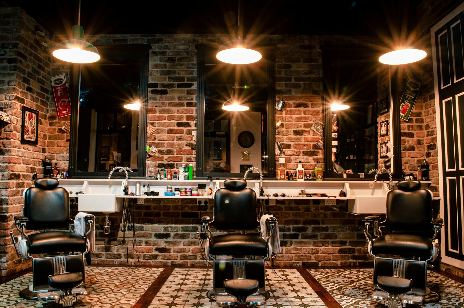 FADEHOUSE barbershop interior with brick walls and vintage chairs