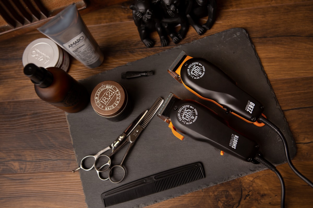 Flatlay of barber clippers and grooming tools